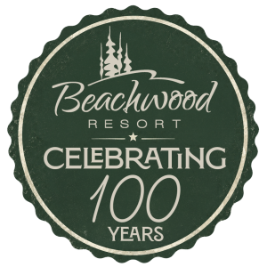 A badge with Beachwood Resort logo that reads "Celebrating 100 Years"